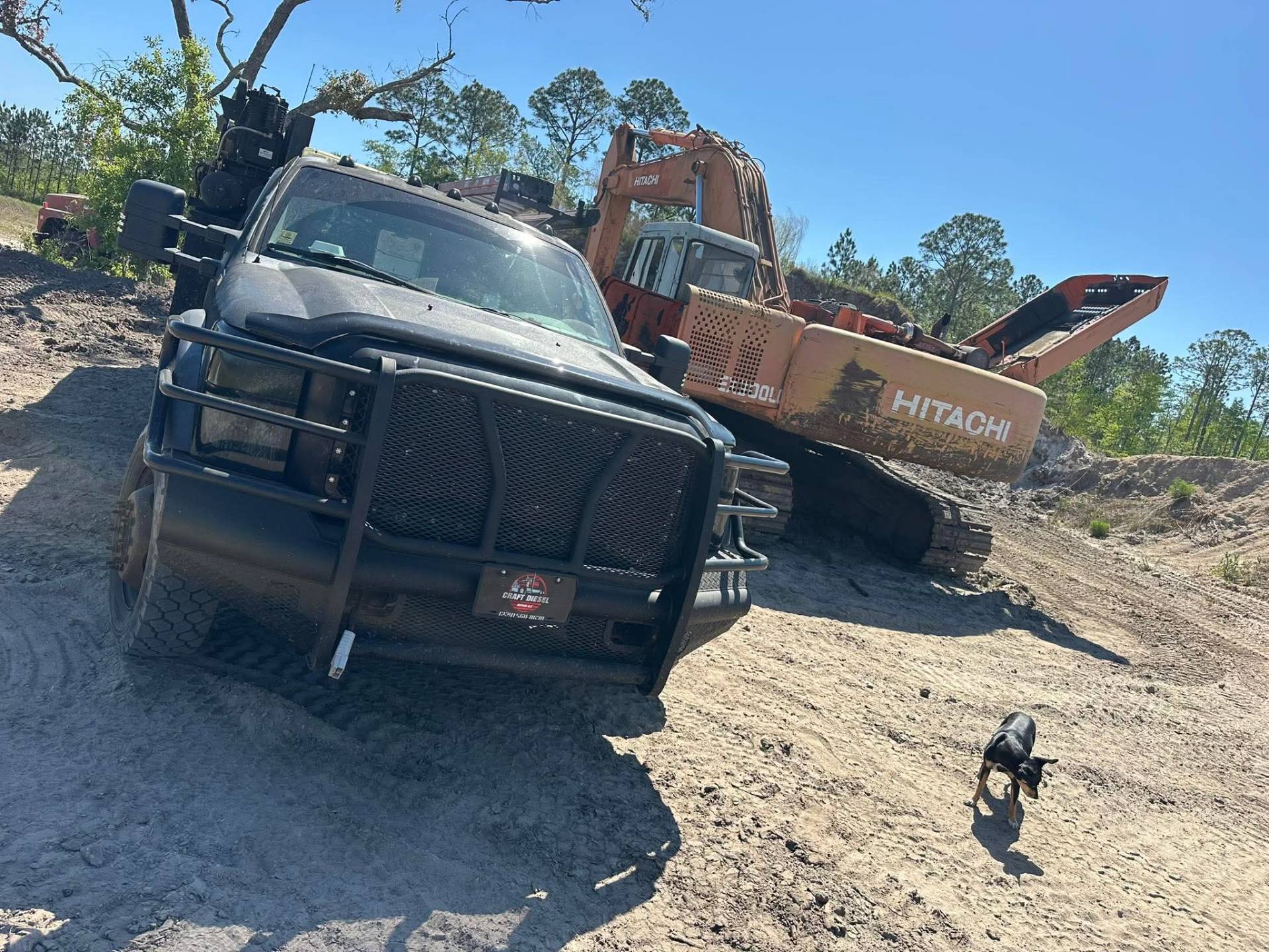 Craft Diesel service truck alongside a Hitachi excavator